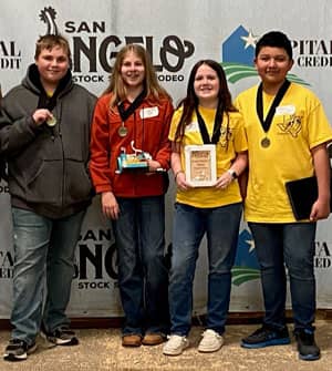 Four students with their awards
