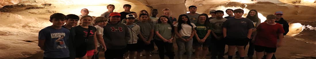 Students in a cave