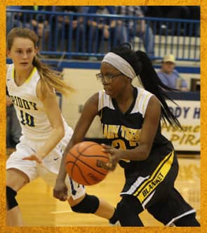 Two girls playing basketball