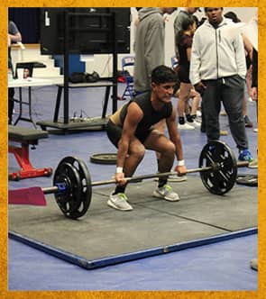 Student lifting weights