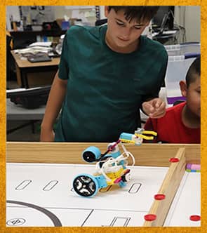 Student working with robot