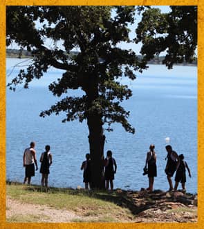 Students by a lake