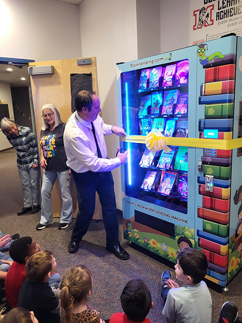 Ribbon cutting event at Mountain Meadows for the new book machine