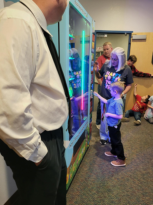 Mountain Meadows students checking out the new book machine