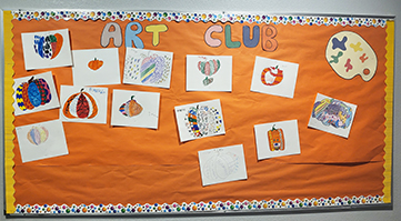 Mountain Meadows student artwork Fun bulletin board displaying Art Club projects
