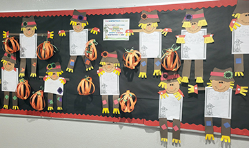 Fun bulletin board displaying student scarecrow projects