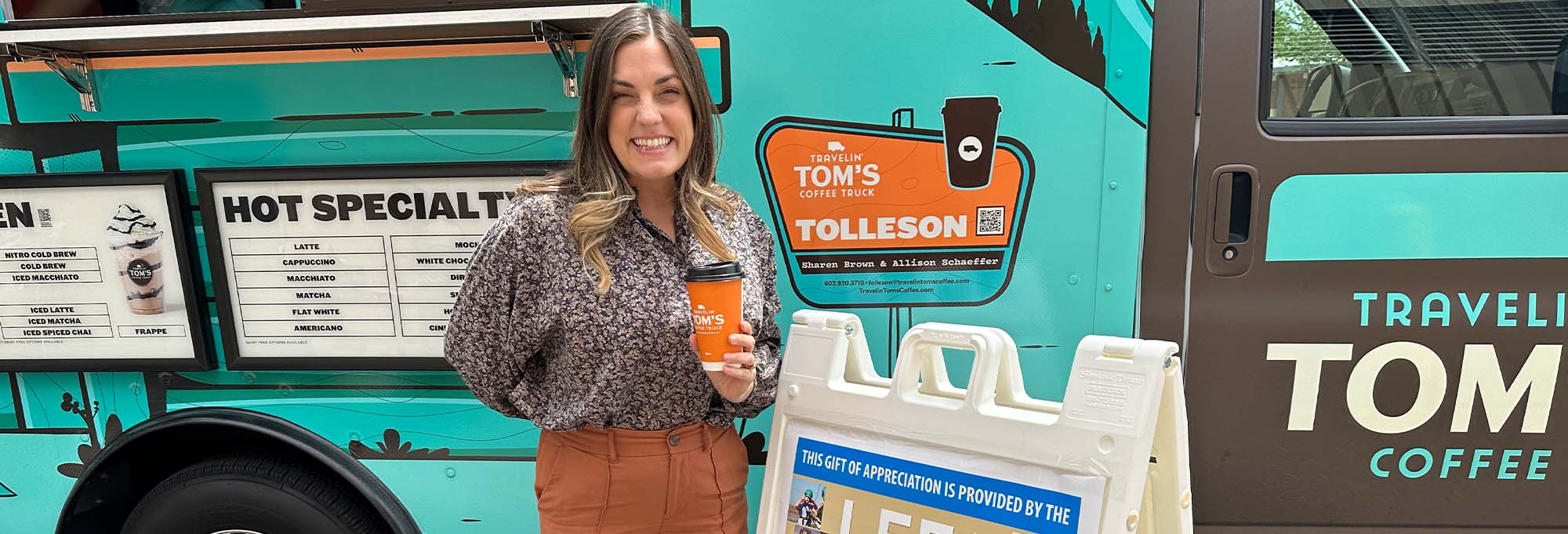 Staff member in front of coffee truck