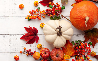 Assorted pumpkins and colorful leaves