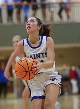 Student playing basketball