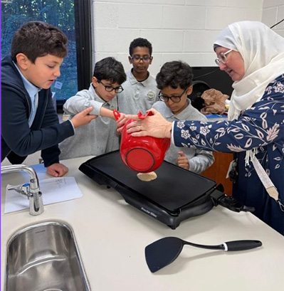 Fifth graders making pancakes