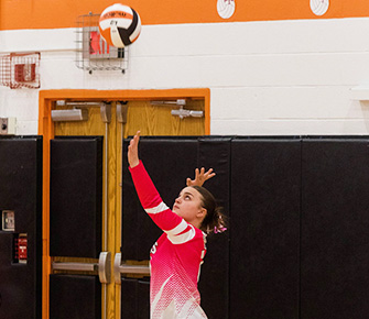 Girl volleyball player during a game