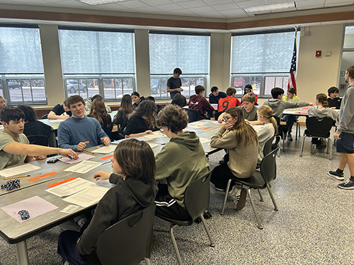 Students sitting at a long table
