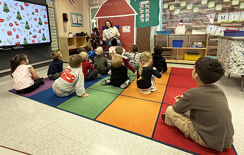 Superintendent, Dr. Haberberger, reading to the Pre-K Counts class