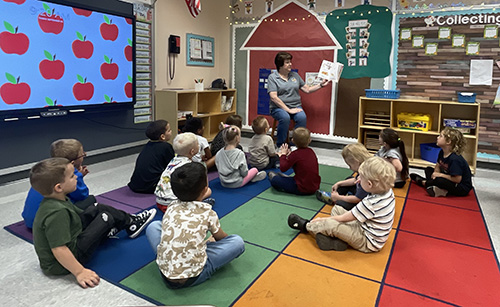 Mrs. Allegretto reading to the Pre-K class