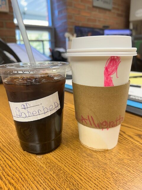 Two cups of coffee on a counter