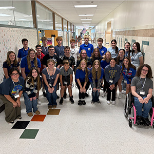 group photo of students lined up in the hallway