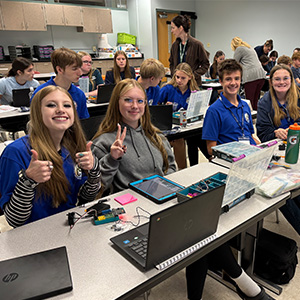 Smiling students in a classroom