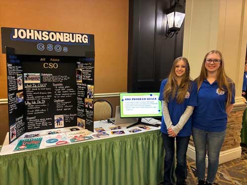 Two students newt to a Johnsonburg CSOs display