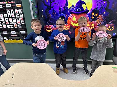 Students showing their art projects