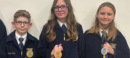 Students holding FFA awards