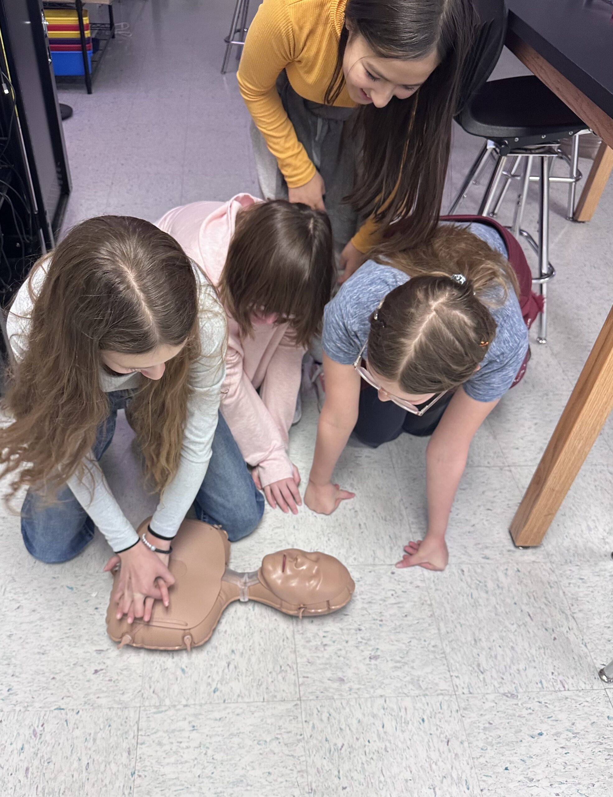 Group of students learning CPR
