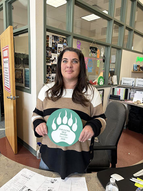 Staff of December holding CMS Extra Mile award