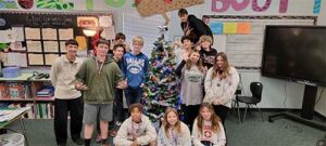 Students with a decorated christmas tree