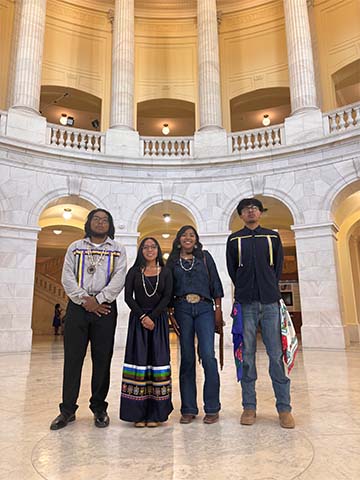 Four students in a building