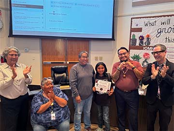 Student of the month with staff members