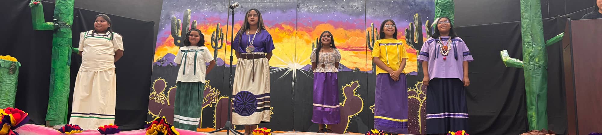 Students on stage performing