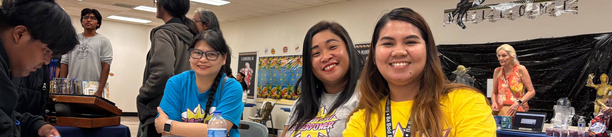 Three staff members at a table