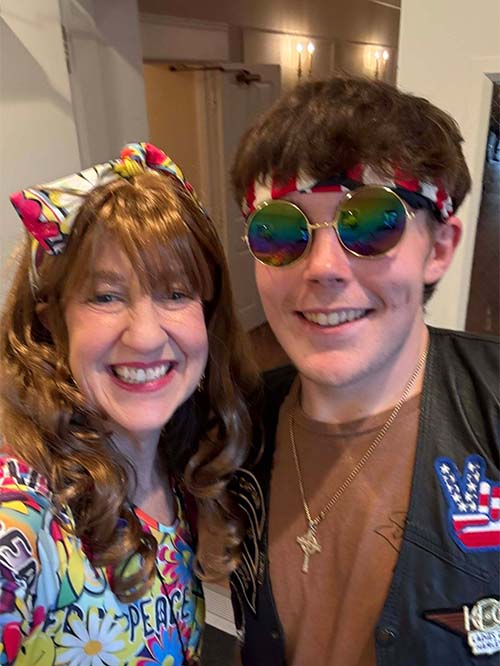 male and female teacher dressed up together and smiling