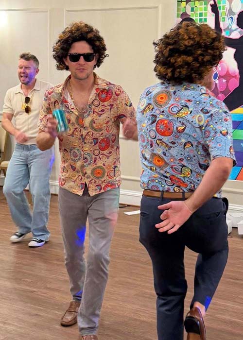 Two male teachers dancing