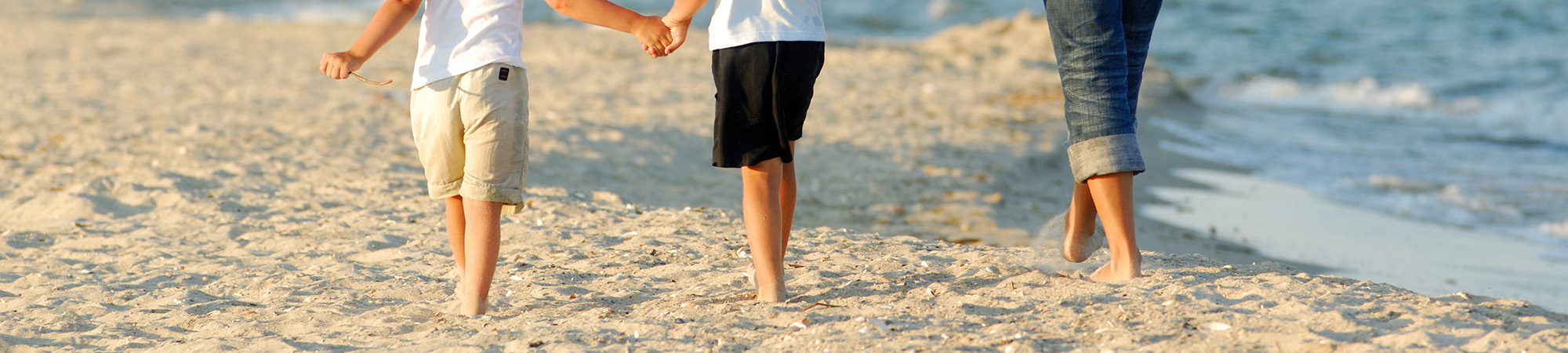 Family walking on a beach