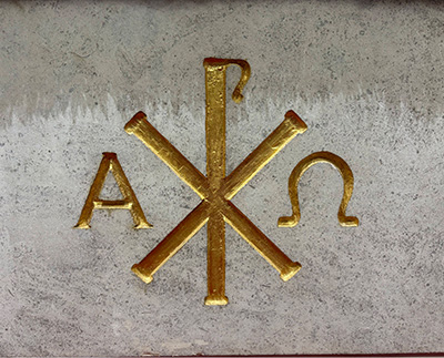 The gold symbol on the front of the alter