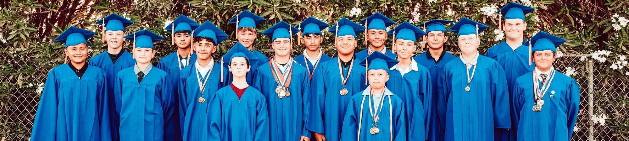 Students in graduation cap and growns