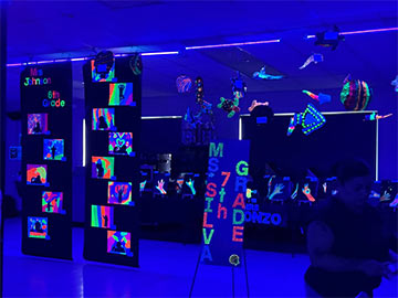 Ms Silva's 7th grade class art displayed under blacklight Ms Silva's 7th grade class art displayed under blacklight