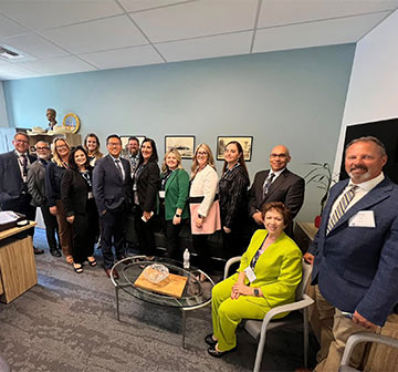 Staff members group photo in the office Staff members group photo in the office