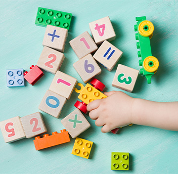 student playing with blocks