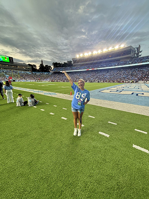 Layla Brewer on a football field
