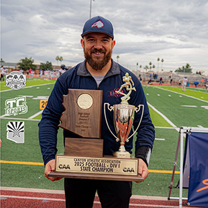 Jalen holding trophy