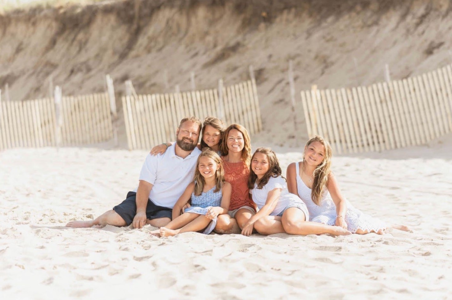 Jenilee Lasure with her family on a beach