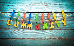 Community spelled out with letters and clothepins
