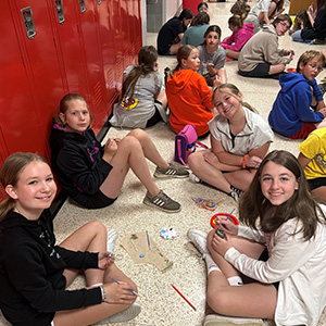 Students sitting in the hallway