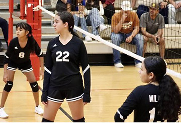 Students playing volleyball
