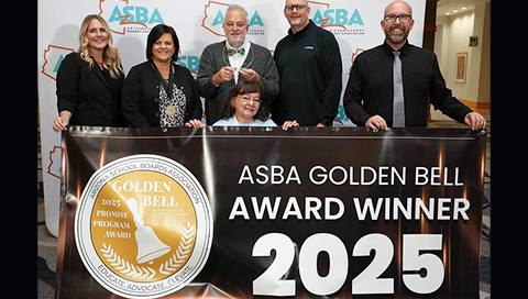 School board member receiving ASBA Golden Bell for 2025