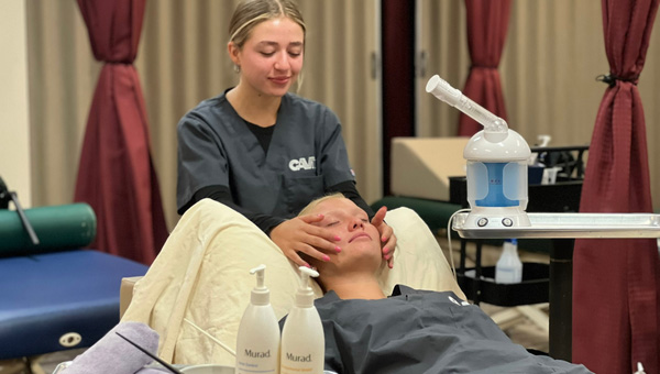 student giving a facial