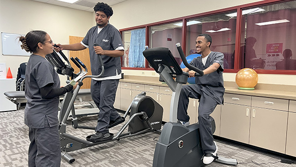 students working with exercise equipment