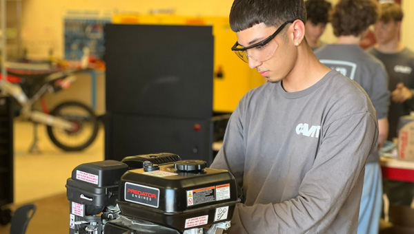 student working on an engine