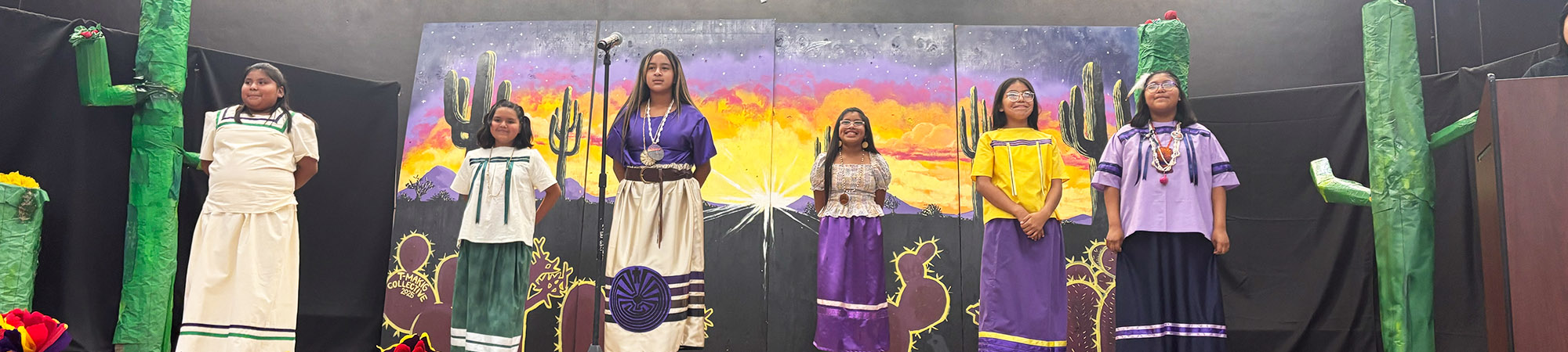 Students performing on a stage
